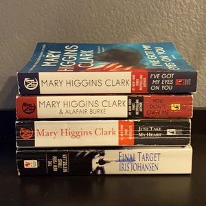 Mary Higgins Clark and Iris Johansen paperback books.